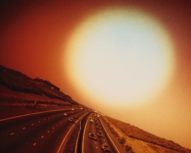 Giant Sun over Expressway by John Cooper (b.1939) © Special Photographers Archive/ out of copyright